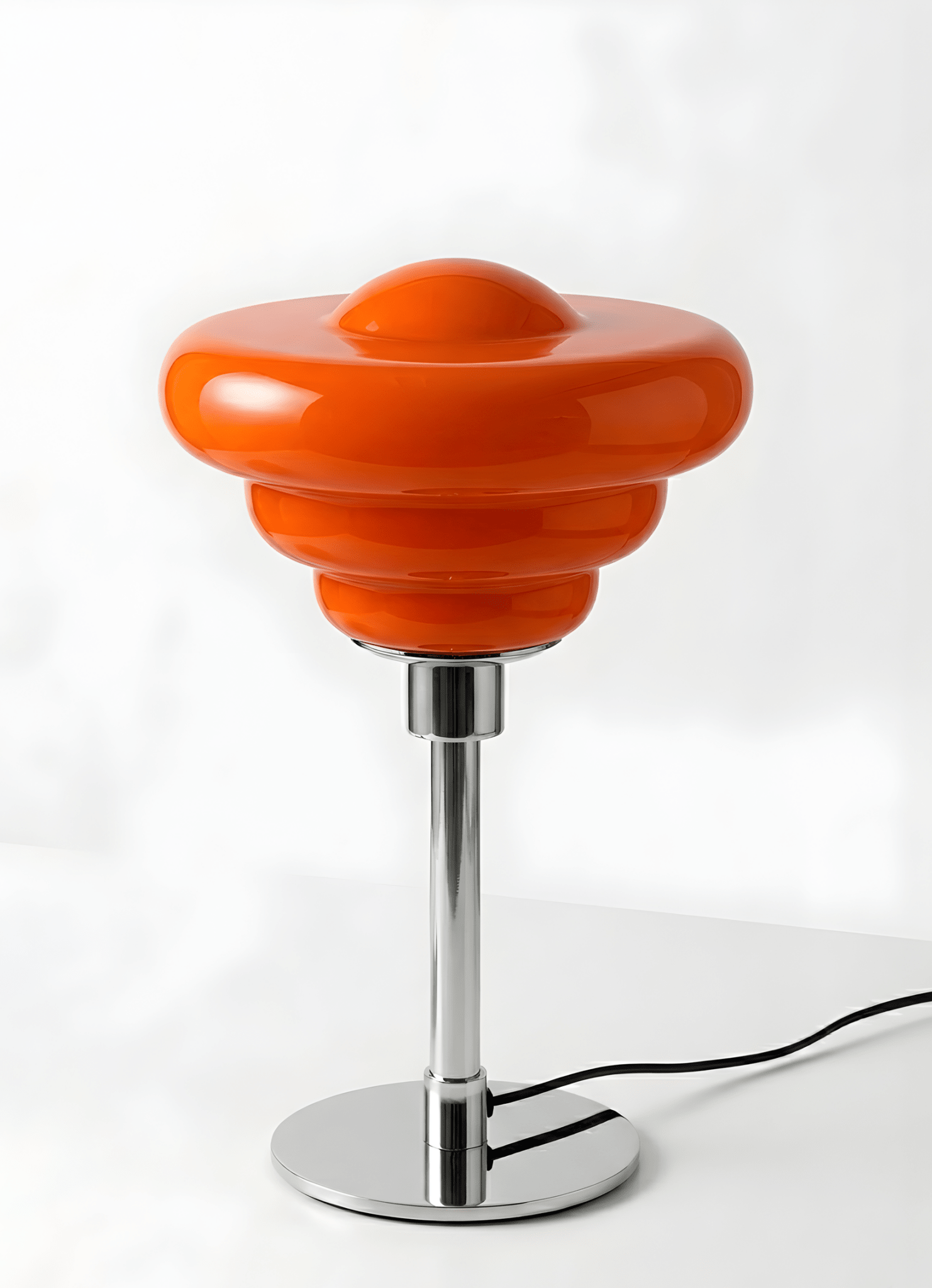 Bergamo Conch Shell Table Lamp in terracotta orange with sculptural resin base and chrome stem on white background