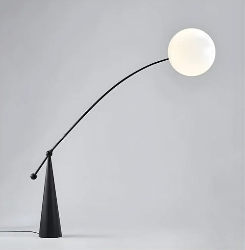 Amalfi black sculptural arc floor lamp with frosted globe shade gray background